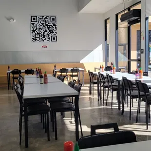 Inside dining and menu. Menu barcode on wall. Just need to scan with phone.