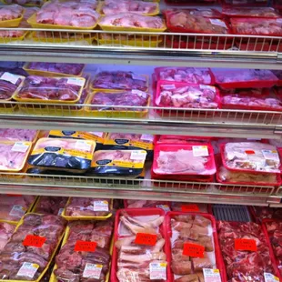 ows a variety of meat in plastic containers