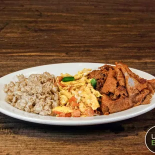 a plate of food on a wooden table