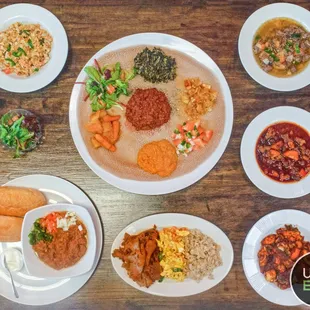 a variety of dishes on a wooden table