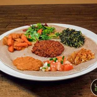 a plate of food on a wooden table