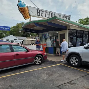 a couple of cars parked in a parking lot
