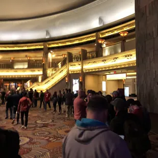 Placing bets. Wrapped around the bar.