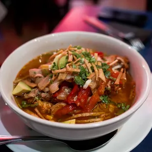 Chicken Tortilla Soup... Soup freshly poured at table.