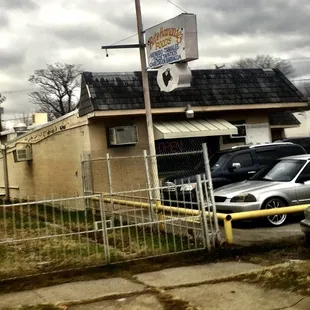 a car parked in front of a restaurant