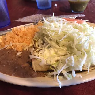 Best dish EVER. Rolled tacos covered in green sauce, cream, cabbage and lime juice.