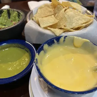 Queso, guacamole, chips and salsa