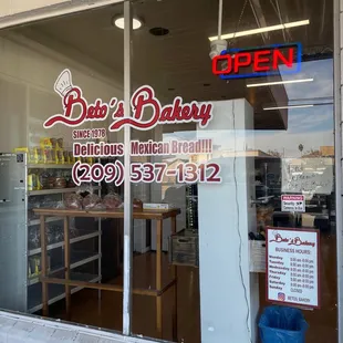 a view of a bakery through the window