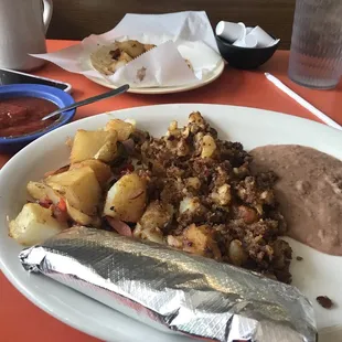 Chorizo con papas with a side of beans