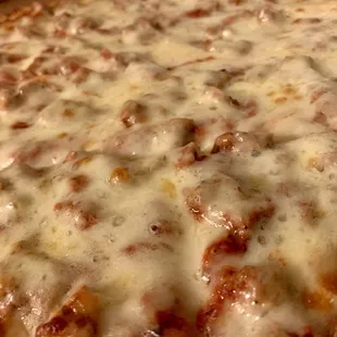 Large cheese and sausage pizza