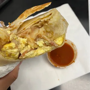 Bacon breakfast burrito.  Shredded hash browns hit the spot!