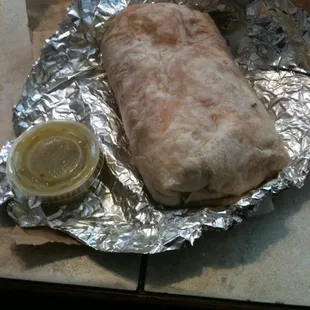 Supreme chicken burrito, no beans and extra green salsa