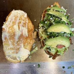 a sandwich with lettuce and avocado