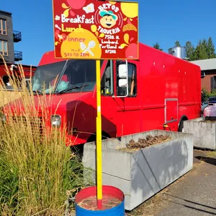 Look for the bright red truck!