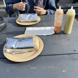 a man sitting at a picnic table