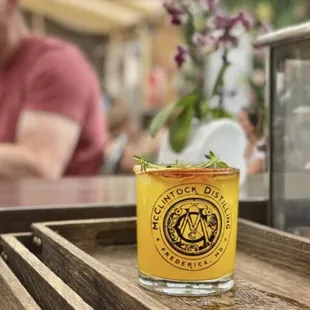 a glass of beer on a wooden table