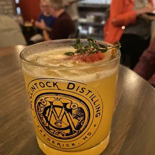 a glass of beer on a table
