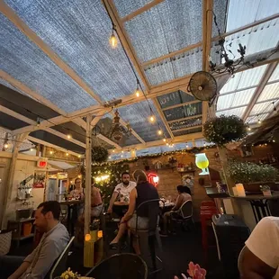 a group of people sitting in a restaurant