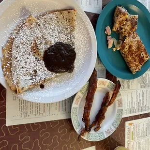 Simple &amp; Sweet Crepes with cinnamon &amp; apple butter, side of bacon, and a savory crepe.