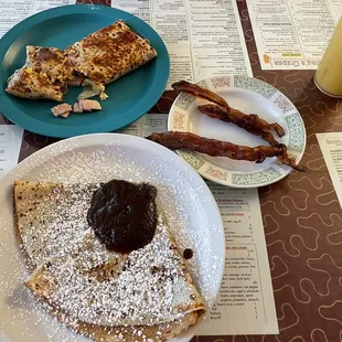 Simple &amp; Sweet Crepes with cinnamon &amp; apple butter, side of bacon, and a savory crepe &amp; orange juice.
