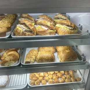 Croissant sandwich and doughnuts in the display for the day