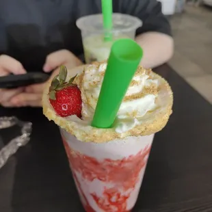 Strawberry cheesecake milk tea with strawberry popping boba.  Oh so good!