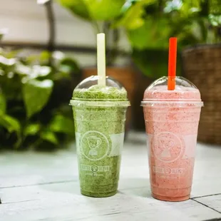 two smoothie drinks on a table