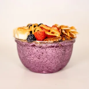 a bowl of fruit and nuts