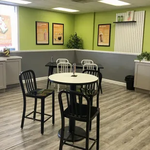 a table and chairs in a restaurant