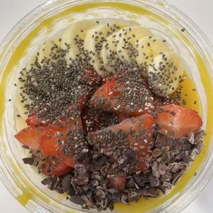 strawberries, bananas, and chia seeds in a bowl