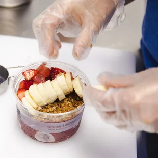 a person preparing a smoothie