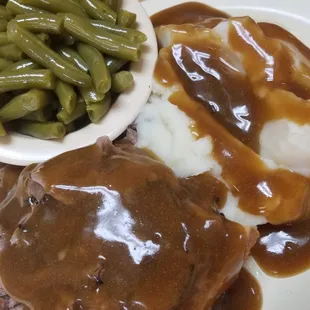 Open-faced roast beef, mashed potatoes &amp; gravy, and green beans.