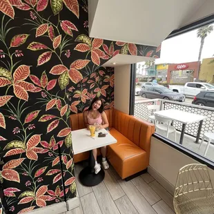 a woman sitting at a table