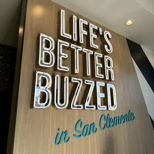 a sign that says life's better buzzzled in san clement