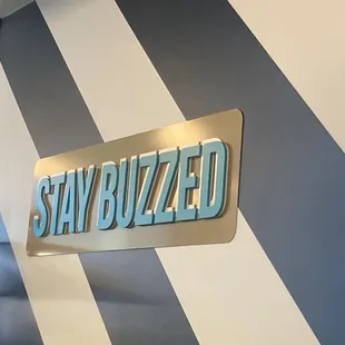a sign that says stay buzzzed
