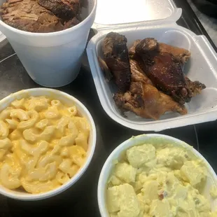Brisket, smoked wings, mac and cheese, and potato salad