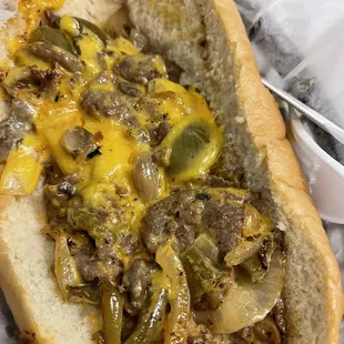 a hot dog with cheese and onions