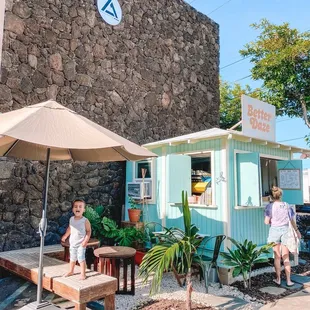 a couple of people standing in front of a building