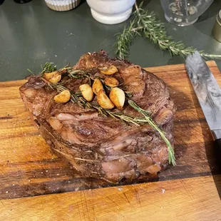 a steak on a wooden cutting board