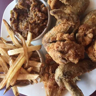 Fried chicken dinner (wings) with red beans and rice and hand cut fries