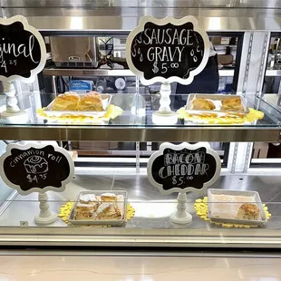 a hand holding a half eaten pastry