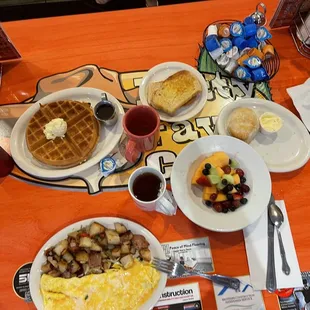 a table full of breakfast foods