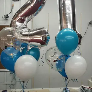 Jumbo numbers  in gold or silver in any bouquet or by themselves.