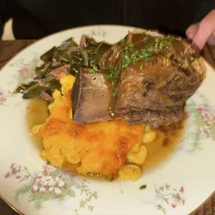 Beef short rib with macaroni and cheese and collards