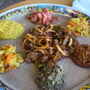 I had the vegetable platter and Awaze Chikina Tibs in the middle.