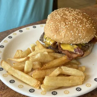 a hamburger and fries on a plate