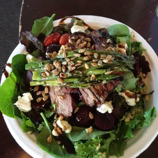 Betty's Baked Eggs with asparagus, goat cheese, etc. on mixed greens; if ya gotta eat your vegetables this is the way to go!