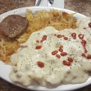 The special with side of hash browns and their gunslinger hot sauce added