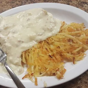 Small Biscuits and gravy with side of glorious hash browns