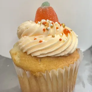 a cupcake with frosting and sprinkles